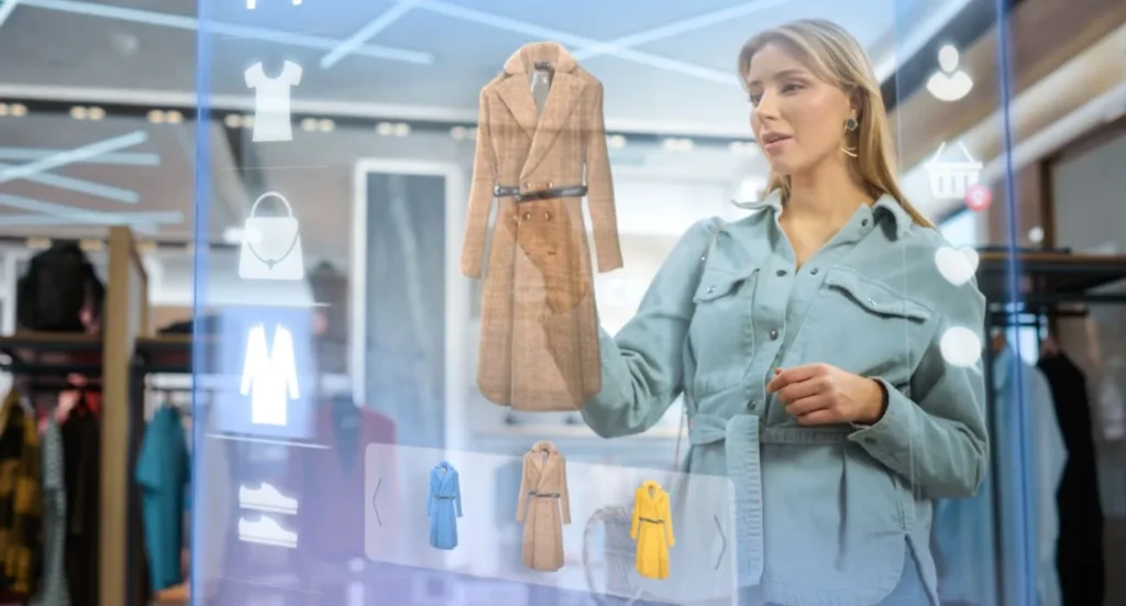 Una donna in un negozio di abbigliamento utilizza un ologramma per selezionare capi di abbigliamento in modo virtuale, rappresentando l'innovativa fusione tra moda e tecnologia